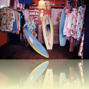 Russell Lewis in Henri Surf Shop, Curl Curl, late 1970s. Photograph courtesy and © Hugh McLeod/Aitionn++