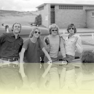 Tony ‘Humph’ Humphreys, Paul ‘Surl’ Goffett, Brad ‘Pork’ Andersen and Jeff ‘Critter’ Morris in car park at Long Reef, <br>Chris Seller, late 1970s. Courtesy Warren MacKenney. © Chris Seller ++